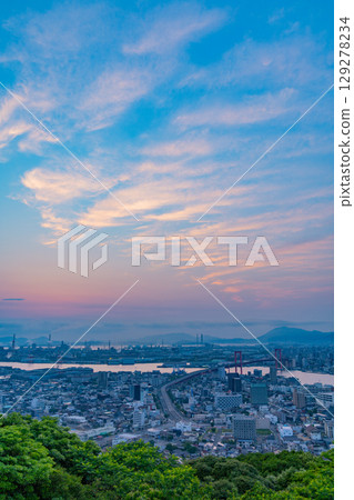 [Fukuoka Prefecture] Kitakyushu City, Wakato Bridge and cityscape seen from Mt. Takato at dawn 129278234