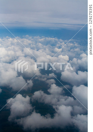 beautiful thick clouds in the sky from the height of the plane 129278391