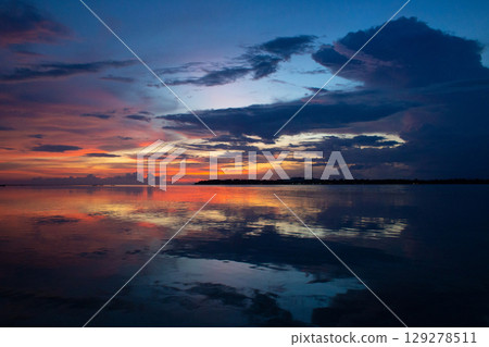 beautiful dramatic landscape of sunset on the sea beach beautiful dramatic landscape of sunset on the sea beach 129278511