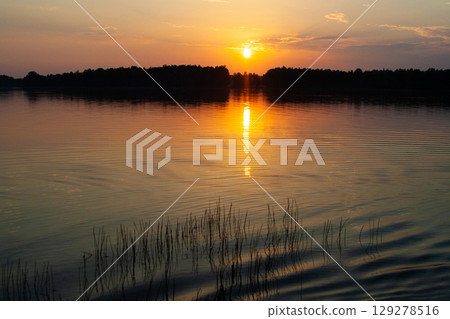 beautiful and picturesque sunset landscape on the lake beautiful and picturesque sunset landscape on the lake 129278516