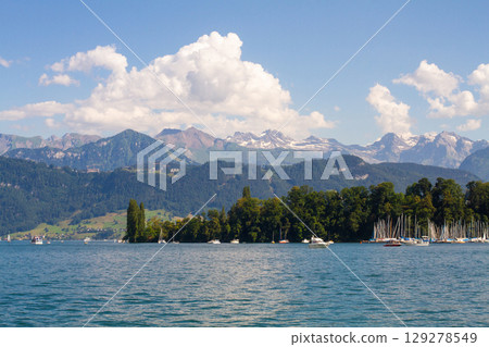beautiful ships and boats are moored near the shore 129278549