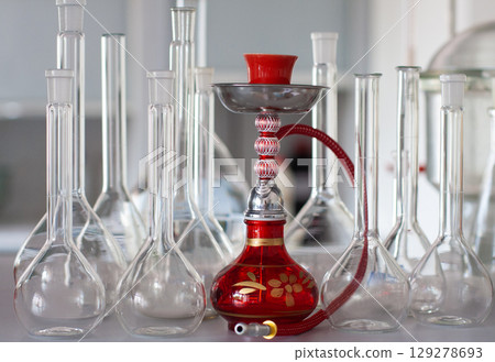 composition of red hookah and chemical glass flasks 129278693