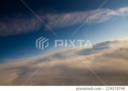 beautiful thick clouds in the sky from the height of the plane 129278746