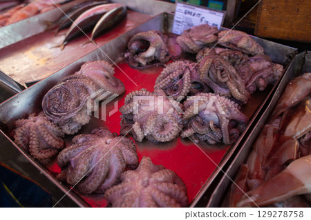fresh marine species of cuttlefish and octopus on the counter 129278758