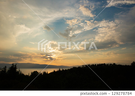 beautiful landscape of mountains on the sea coast at sunset 129278784