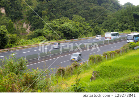 Stock photo of cars driving on the highway Stock photo of cars driving on the highway 129278841