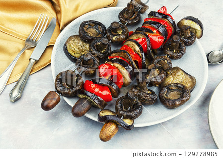 Grilled vegetables on skewers. 129278985