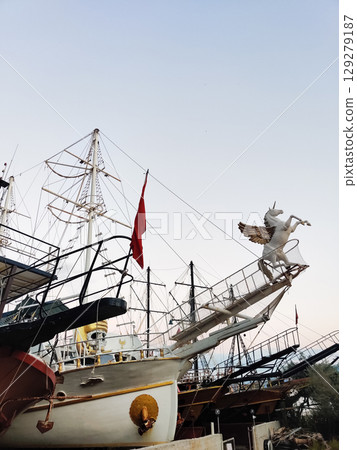 beautiful ships and boats are moored near the shore beautiful ships and boats are moored near the shore 129279187