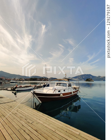 beautiful ships and boats are moored near the shore beautiful ships and boats are moored near the shore 129279197