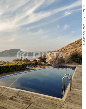 a beautiful large swimming pool near the house 129279199