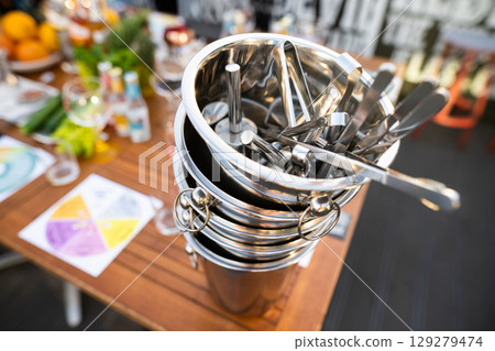 metal ice bucket on bar counter with ice scoop tool metal ice bucket on bar counter with ice scoop tool 129279474