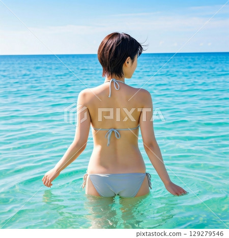Young woman in bikini in the sea 129279546