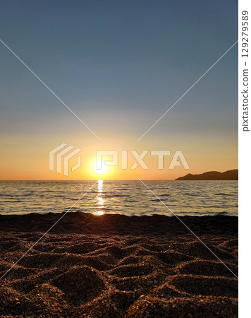 beautiful dramatic landscape of sunset on the sea beach beautiful dramatic landscape of sunset on the sea beach 129279589