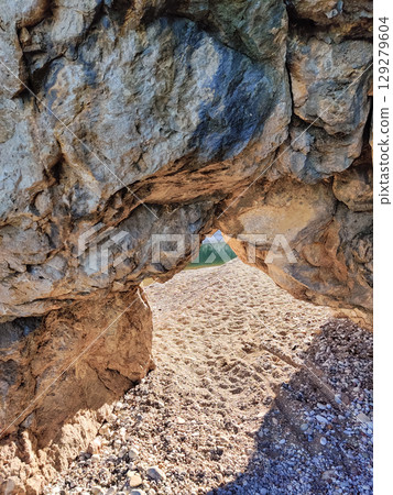 texture of a large stone rock on a sea beach texture of a large stone rock on a sea beach 129279604