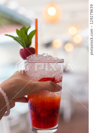 close up of a beautiful fruity alcoholic cocktail 129279639