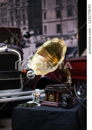 beautiful decorations and various decor in retro style near the gramophone 129279645