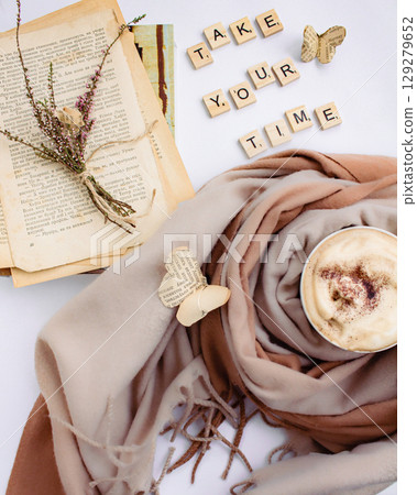 a beautiful arrangement of a bouquet of flowers and a book with a cup of coffee a beautiful arrangement of a bouquet of flowers and a book with a cup of coffee 129279652