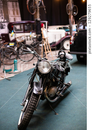 old retro motorcycle at an exhibition of motor vehicles 129279655