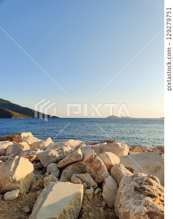 beautiful seascape on the horizon silhouette of mountains beautiful seascape on the horizon silhouette of mountains 129279751