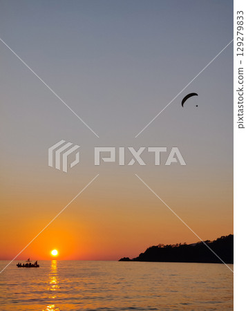 beautiful landscape with a view of the sea flying on a paraglider beautiful landscape with a view of the sea flying on a paraglider 129279833