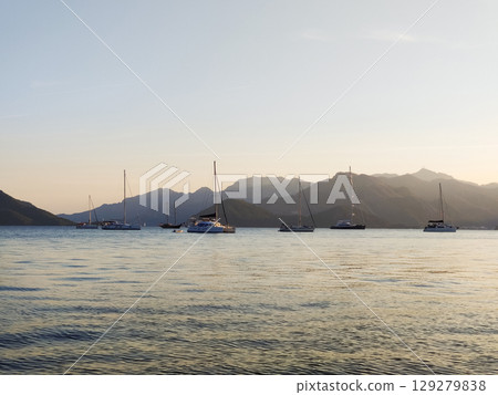 beautiful ships and boats are moored near the shore beautiful ships and boats are moored near the shore 129279838