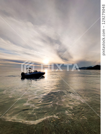 a beautiful ship is sailing in the blue sea 129279848