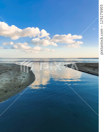 beautiful landscape of a sandy beach on the sea beautiful landscape of a sandy beach on the sea 129279905