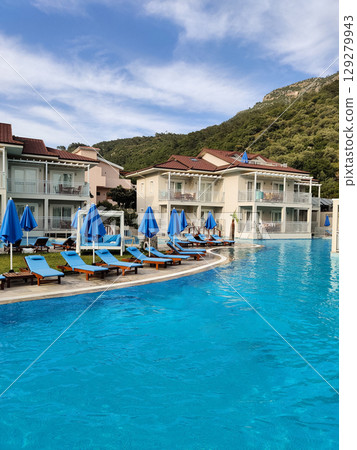 a beautiful large swimming pool near the house 129279943