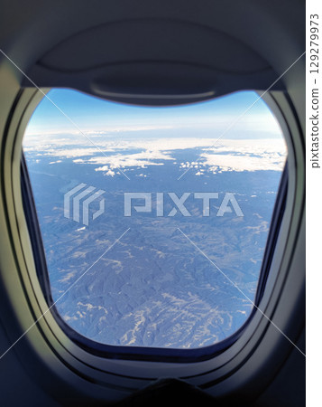 sky from the height of the flight of the plane in round window 129279973