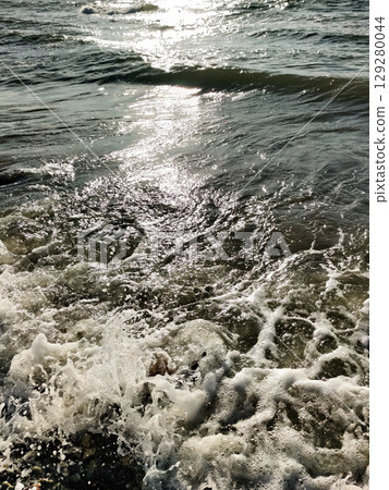 texture of sea water and waves looking from above texture of sea water and waves looking from above 129280044