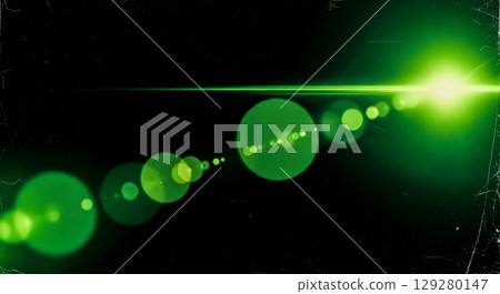 Cinematic lens flare overlay with green light on black background, abstract anamorphic beam with old film texture for video editing and special effect Cinematic lens flare overlay with green light on black background, abstract anamorphic beam with old film texture for video editing and special effect 129280147
