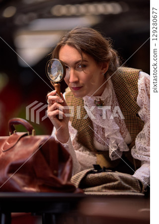 beautiful woman scientist in retro style with magnifying glass 129280677