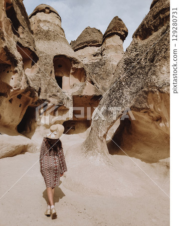 girl on the beautiful mountain scenery in the city Cappadocia in Turkey 129280731
