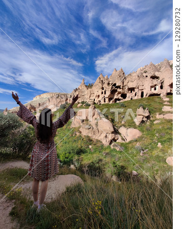 girl on the beautiful mountain scenery in the city Cappadocia in Turkey 129280732