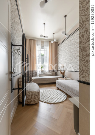 Cozy Guest Room with Beige Daybeds and Soft Lighting 129280883