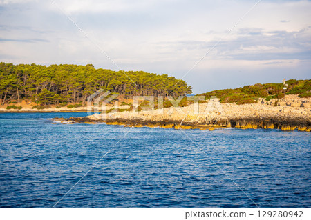 Uninhabited islands of the Lastovo National Park surrounded by calm sea in Croatia. Nature reserve, remote landscape and Mediterranean summer escape 129280942
