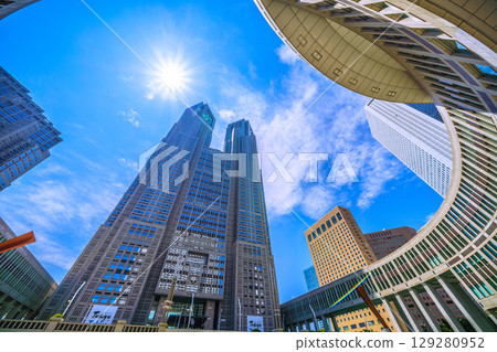 Tokyo cityscape, Japan, August 5th. Extremely hot... View of Tokyo Metropolitan Government Building... A ray of hope for a new era... Tokyo cityscape, Japan, August 5th. Extremely hot... View of Tokyo Metropolitan Government Building... A ray of hope for a new era... 129280952