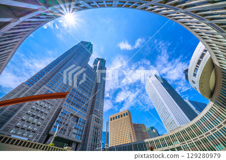 Tokyo cityscape, Japan, August 5th. Extremely hot... View of Tokyo Metropolitan Government Building... A ray of hope for a new era... Tokyo cityscape, Japan, August 5th. Extremely hot... View of Tokyo Metropolitan Government Building... A ray of hope for a new era... 129280979