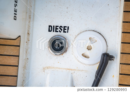 Diesel fuel inlet on the deck of a sailing yacht near Croatia, marked with the word Diesel. Technical detail, maintenance and essential part of boat operation. 129280993
