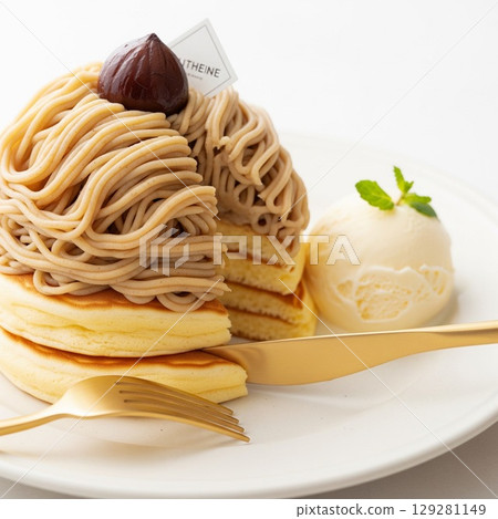 Fluffy pancakes served with rich chestnut cream and ice cream 129281149