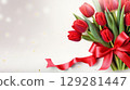 Vibrant bouquet of tulips wrapped with a red ribbon showcasing beauty and elegance for any special occasion 129281447