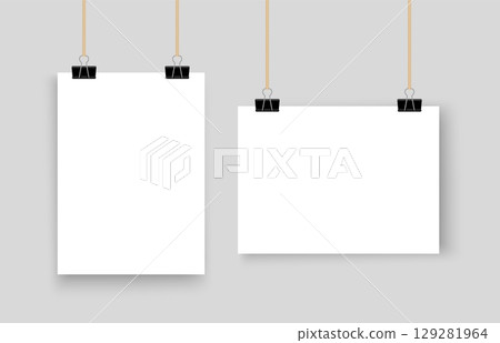 Two realistic poster mockups in horizontal and vertical orientation displayed on binder clips isolated on white background perfect for design showcase 129281964