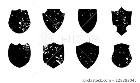 Set of vintage grunge shield shapes with distressed texture and blank space isolated on white background perfect for retro labels stamps and badge designs. Set of vintage grunge shield shapes with distressed texture and blank space isolated on white background perfect for retro labels stamps and badge designs. 129282043