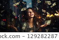 Woman with money falling from her hair 129282287