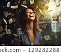 Joyful woman laughing surrounded by money 129282288
