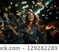 Woman in blue shirt throwing money 129282289