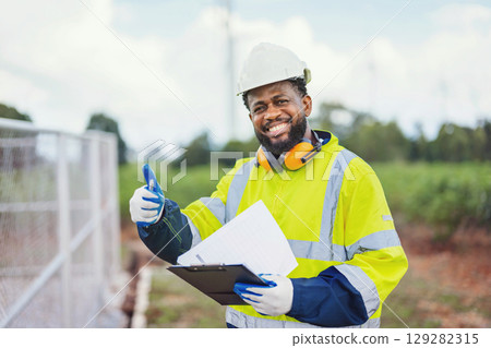 construction worker wearing  yellow jacket 129282315