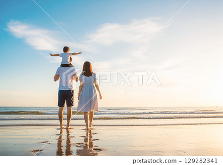Parent and child walking along the beach Parent and child walking along the beach 129282341