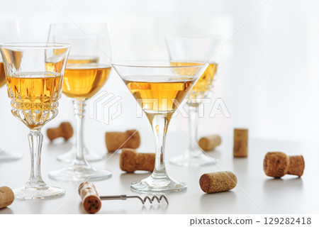 Set of glasses of yellow wine at wine tasting 129282418