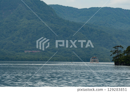 Towada Lake and a pleasure boat Towada Lake and a pleasure boat 129283851